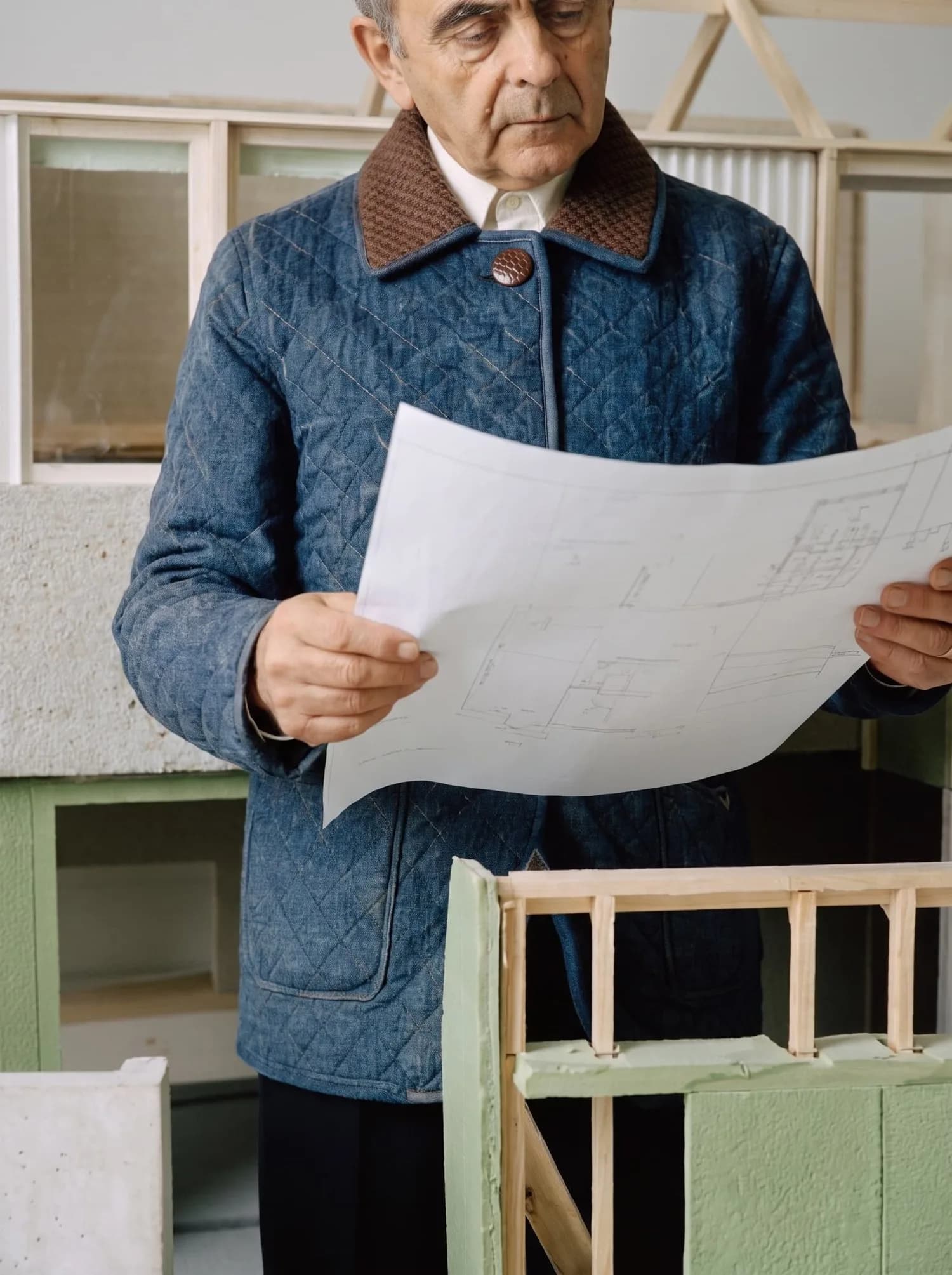 Man holding blueprints
